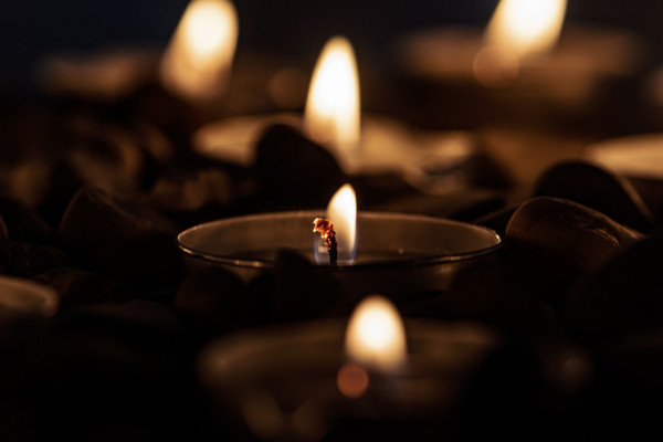 A candle lit in memory of a person's passing