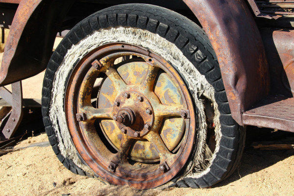 A dilapidated car tyre.