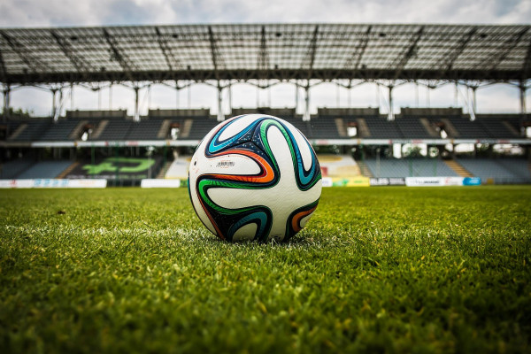 A football in an empty stadium.