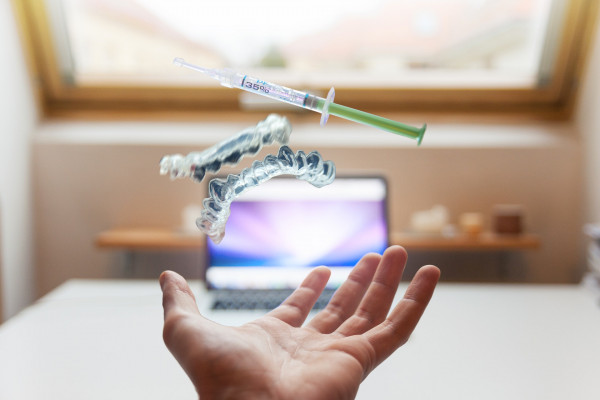 Medical apparatus floating above an outstretched hand.