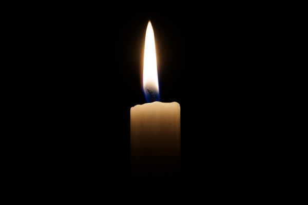 A picture of a candle in the dark