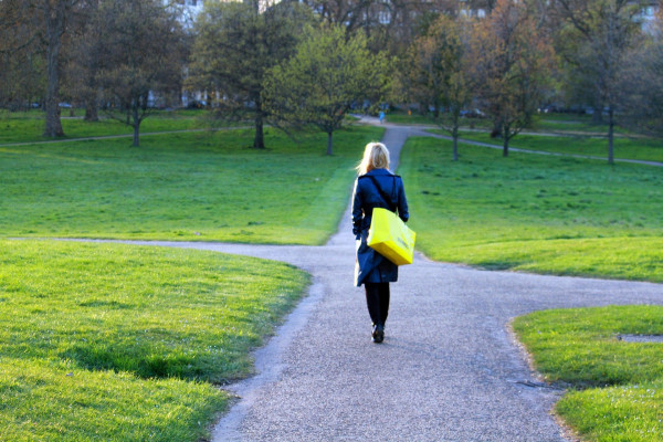 woman approaching a crossroads