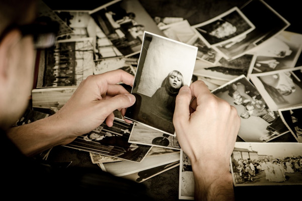 Man looking at photos