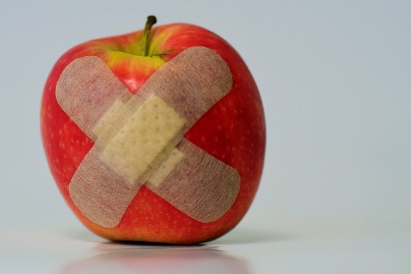 Apple with a plaster