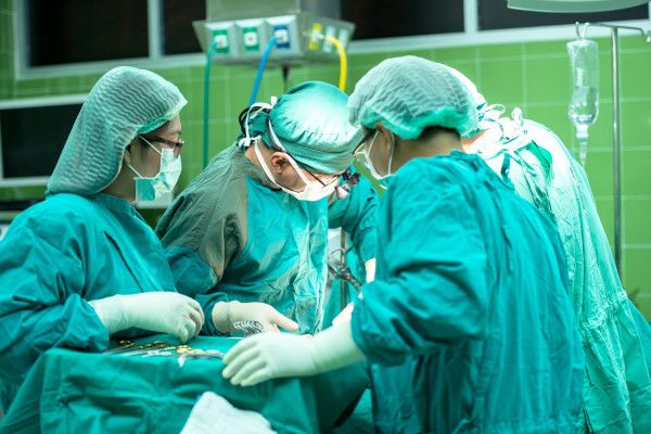 Surgery taking place in an operating theatre