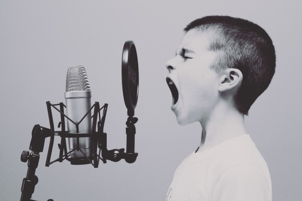 Child shouting into microphone