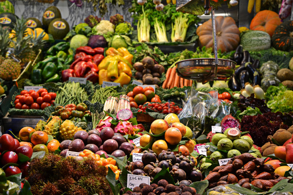 A food market with a wide array of different vegetables.