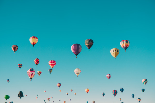 Hot air balloons in a blue sky