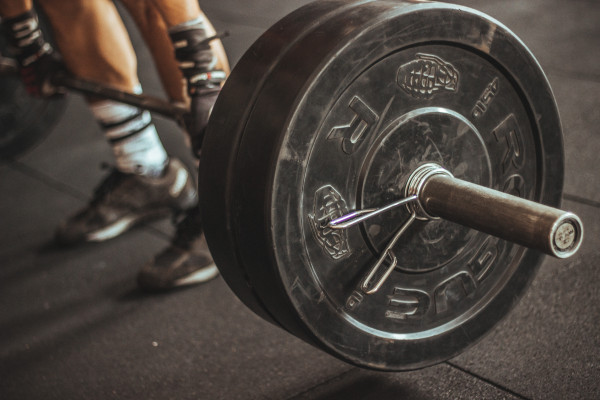 This is a picture of a person lifting a heavy weight bar.