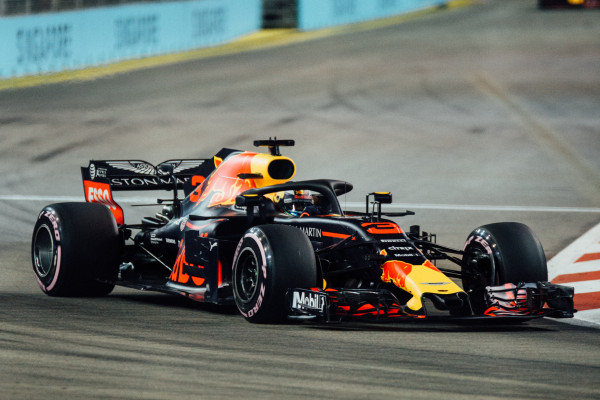 A formula 1 race car on an indoor track