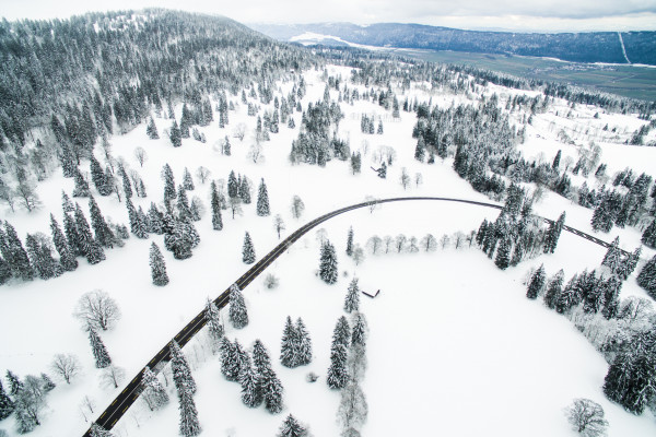 A road running through snowy mountains