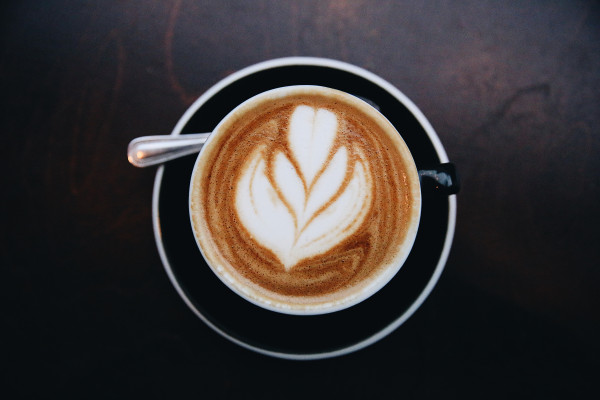 A latte with a petal pattern in the milk