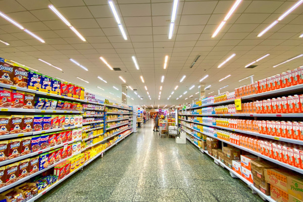 A supermarket aisle empty of people.