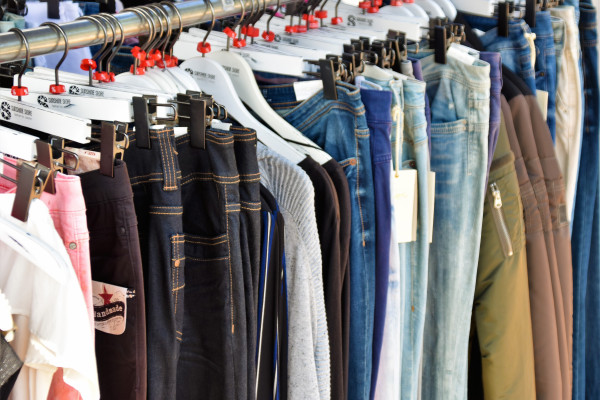 Different denim jeans on a clothes rail