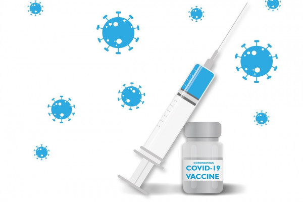 A needle and bottle of the COVID-19 vaccine.
