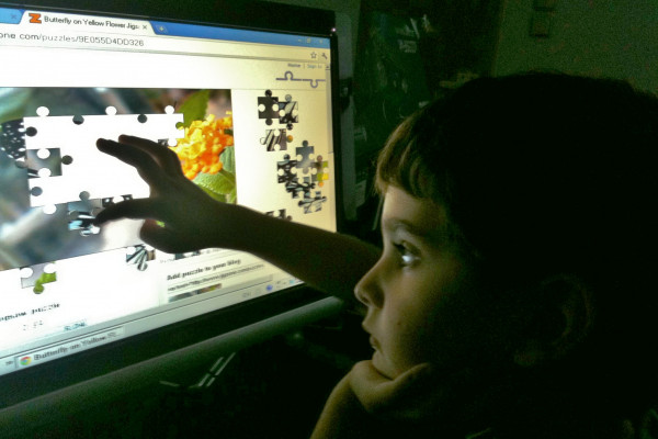 Child using touch screen device