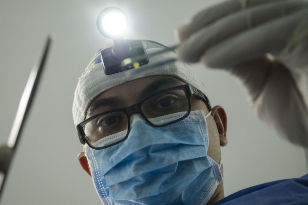 A dentist examining a patient's mouth