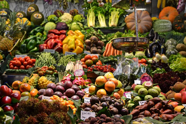 A food market with a wide array of different vegetables.