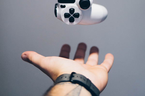 A picture of a levitating PlayStation controller