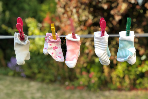 Colourful socks hanging on a washing line
