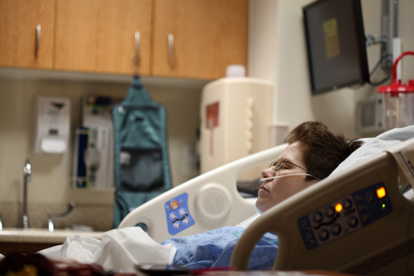 A patient lying in a hospital bed.