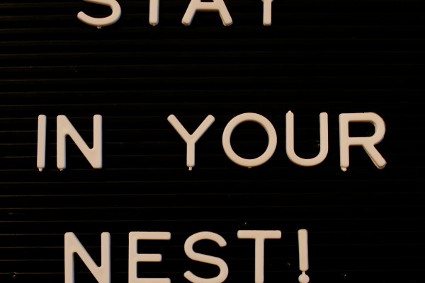 Sign saying STAY IN YOUR NEST