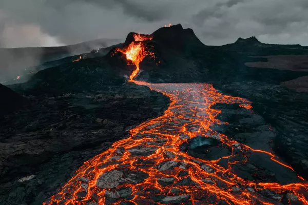 A volcano post-eruption with hot red lava running down