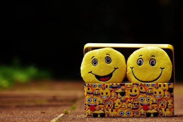 An image of two cartoon smiley faces in a box