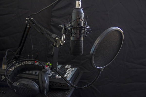 A microphone and mixer recording desk
