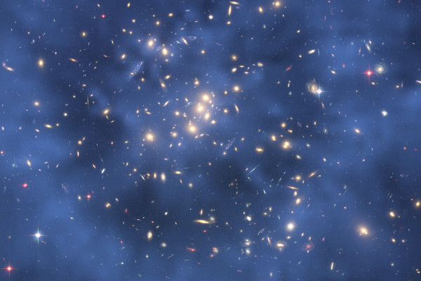 Based on the effect that dark matter has on gravity, a ring of dark matter has been detected in a galaxy cluster (CL0024+17) and has been represented in blue.
