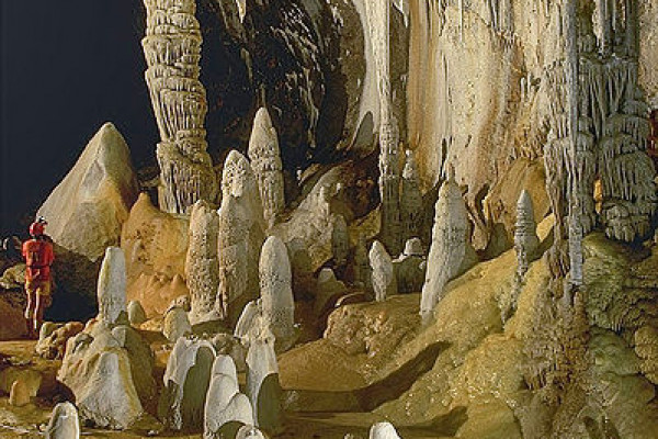 Stalagmites, stalactites, and draperies by a pool in Lechuguilla Cave, New Mexico, USA.