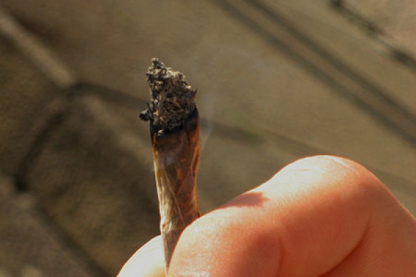 Person smoking a marijuana (cannabis) joint