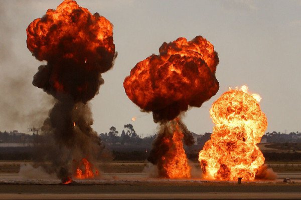 Gasoline explosions, simulating bomb drops at an airshow.