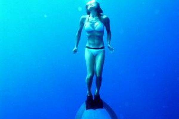 A freediver with a monofin