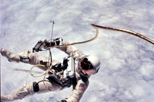  This photograph was taken early in the EVA over a cloud-covered Pacific Ocean. Astronaut Edward H. White II, pilot for the Gemini-Titan 4 space flight, floats in zero gravity of space. The extravehicular activity was performed during the third...