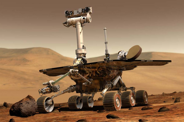 An artist's concept portrays a NASA Mars Exploration Rover on the surface of Mars. Two rovers have been built for 2003 launches and January 2004 arrival at two sites on Mars. Each rover has the mobility and toolkit to function as a robotic geologist.
