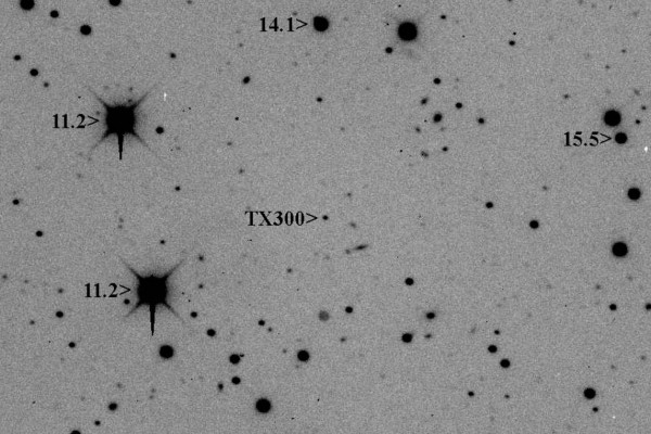 8 minute exposure of dwarf planet candidate (55636) 2002 TX300 with a 24" telescope. TX300 is about apparent magnitude 19.4 in this image taken at 2009-11-16 04:15 UT. The two blooming stars on the left are magnitude 11.2.