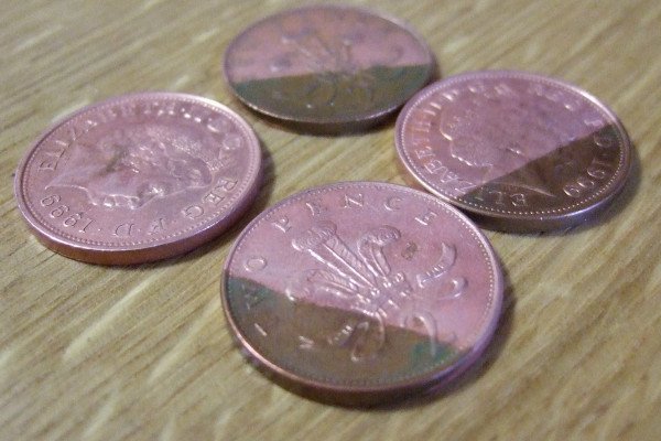 What causes pennies to get dirty?