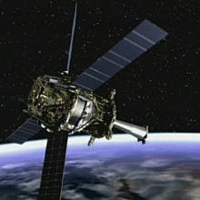 Artist concept of Gravity Probe B spacecraft in orbit around the Earth.