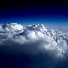 A color-enhanced version of an aerial photograph of Stratocumulus perlucidus clouds; taken from the rear seat of a Northwest Airlines Airbus A320 flying over the midwestern United States, en route from Los Angeles, CA to Minneapolis/St. Paul, MN.