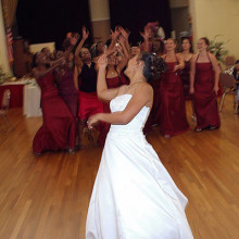 A bride tossing her bouquet of flowers