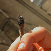 Person smoking a marijuana (cannabis) joint