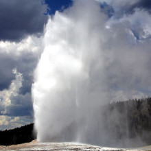 Old Faithful geyser in Yellowstone National Park, USA