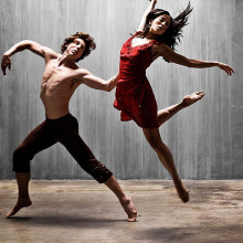 A man and a woman performing a modern dance.