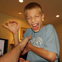 Boy being tickled