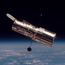 The Hubble Space Telescope (HTS) begins its separation from Space Shuttle Discovery following its release on mission STS-82.