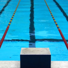 View from the starting block of a competition swimming pool.