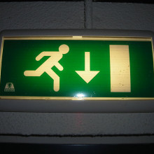 Emergency light with an emergency exit pictogram