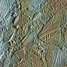 View of a small region of the thin, disrupted, ice crust in the Conamara region of Jupiter's moon Europa showing the interplay of surface color with ice structures. The white and blue colors outline areas that have been blanketed by a fine dust of ice.