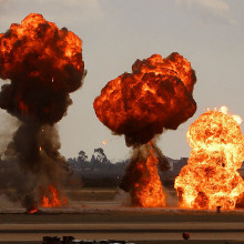 Gasoline explosions, simulating bomb drops at an airshow.